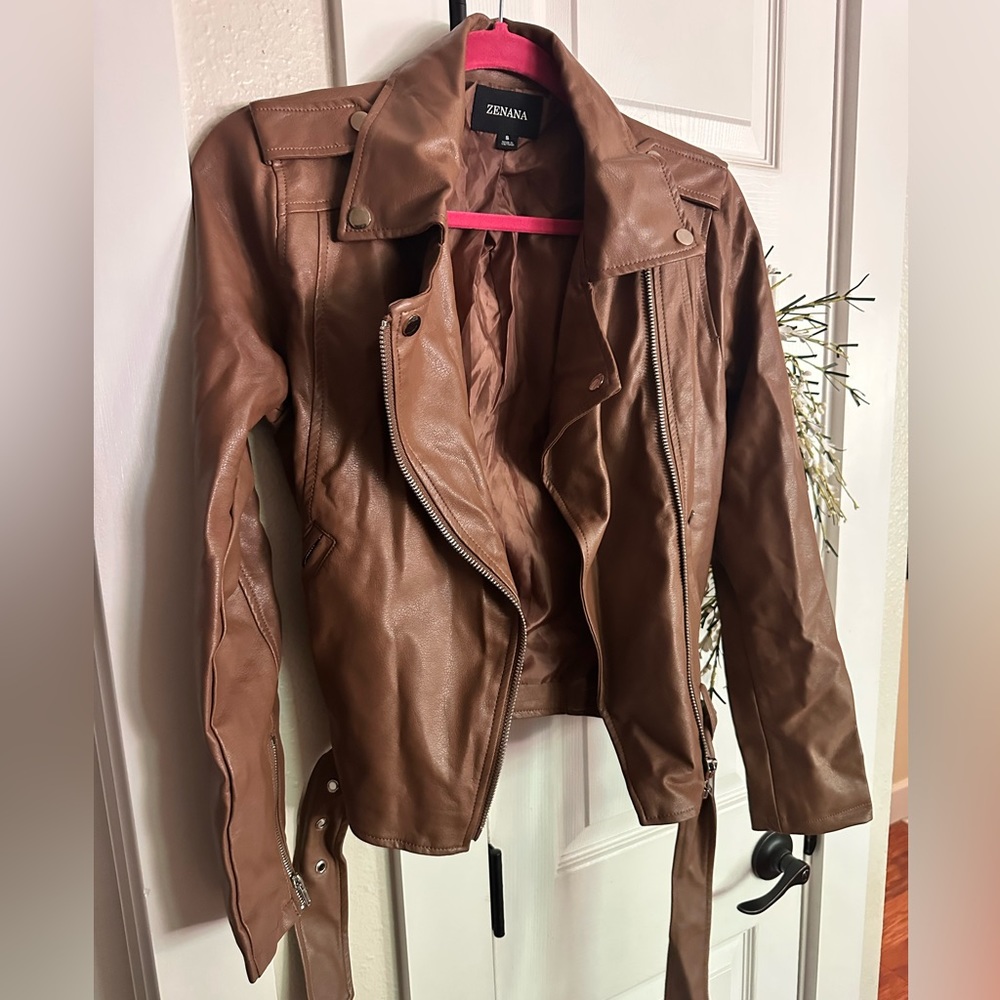 Leather jacket, brown, size small. Never worn but took tags off.